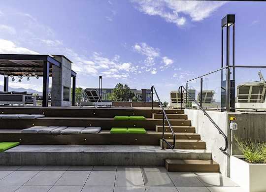 A set of stairs with green steps leading up to a building.