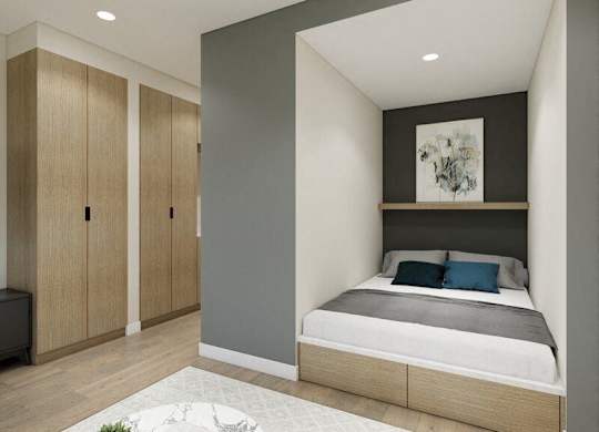 A bedroom with a bed, nightstand, and wardrobe.
