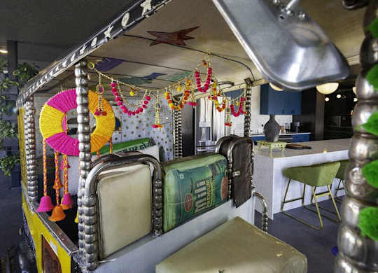 A decorated canopy with a sign that reads "KOLKATA" is in the foreground.