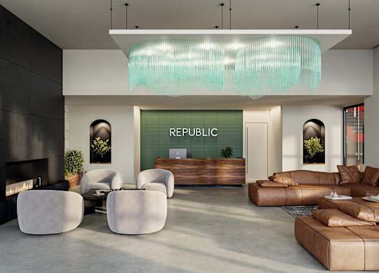 A modern living room with a fireplace and a large sofa.