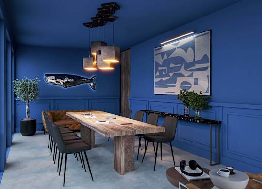 A dining room with a wooden table and chairs.