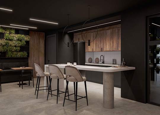A modern kitchen with a dining table and chairs.
