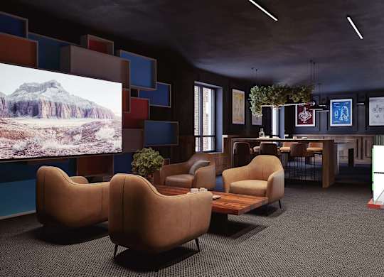 A room with a large screen and comfortable seating.