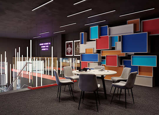 A modern conference room with a table, chairs, and a colorful wall.