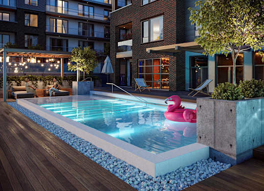 A pool with a pink flamingo float in the middle of it.
