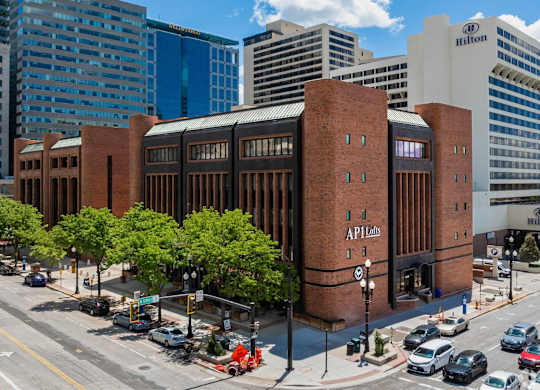 A large brick building with the words API labs on the side.