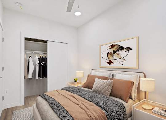 A bedroom with a bed, a nightstand, and a painting of a bird on the wall.