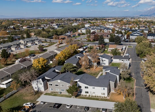 A suburban neighborhood with houses and trees.