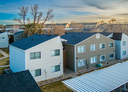 A row of houses with a metal roof.