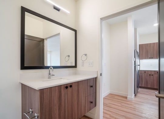 a furnished bathroom with a mirror