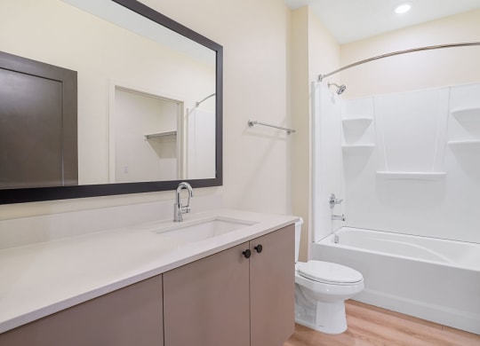 a modern bathroom with a large mirror