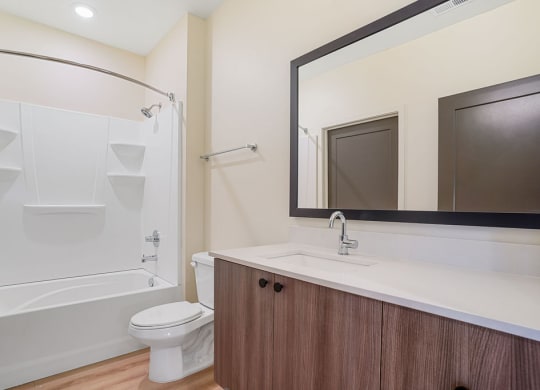 a modern bathroom with a mirror