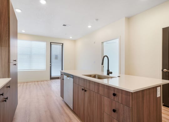 a kitchen with hardwood floors