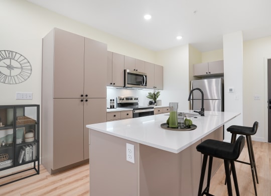 a furnished kitchen with stools