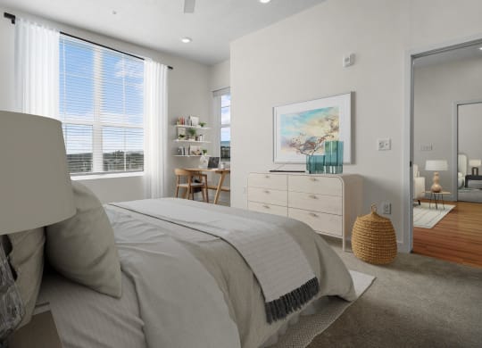 a bedroom with grey bedding 