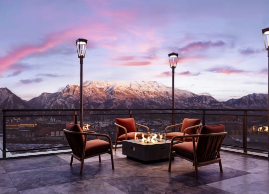 a patio at sunset with a fire pit