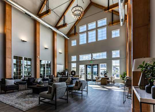 A large, open-concept living space with high ceilings and natural light.