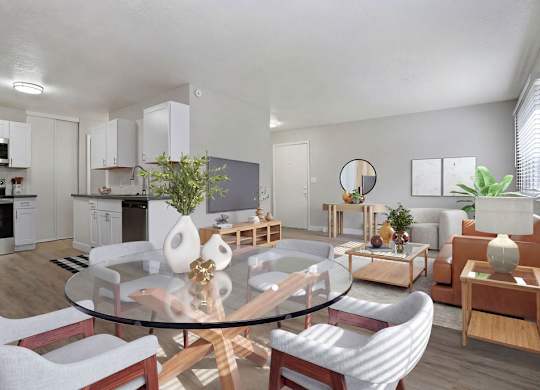 A modern living room with a glass table and white chairs.