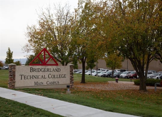 a sign for brickyard technical college in front of a parking lot