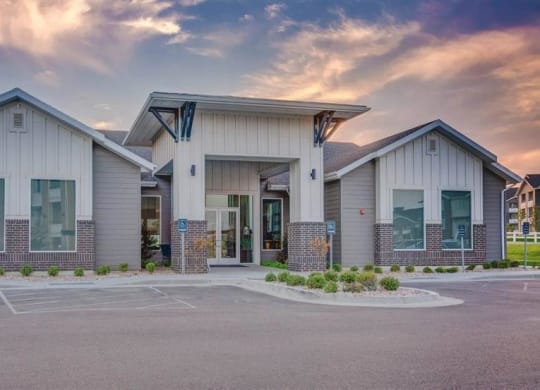an empty parking lot in front of a building  at Affinity 56 Apartments in West Jordan, Utah