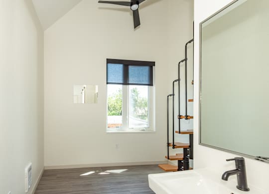 A bathroom with a window and a sink at Society 62 Apartments, Portland 97213