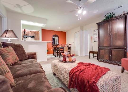 a living room with a couch and a chair at Arbors at Windsor Lake, Columbia