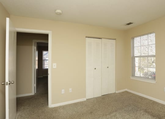 an empty living room with a closet and a window at Brookside Pointe, South Carolina, 29690