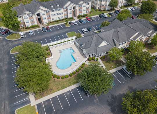 an aerial view of the resort style pool and hot tub at the enclave at woodbridge apartments at Palms on Ashley River Apartments, Ladson, South Carolina