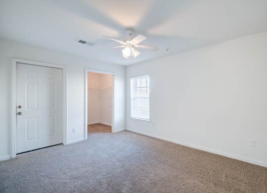 A room with a ceiling fan and carpeted floor.at The Regency Apartment Homes, Virginia, 20109