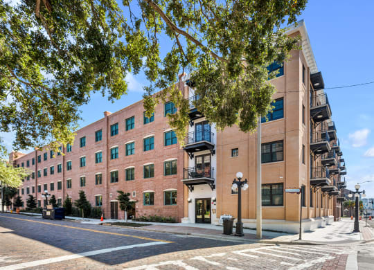 a large brick building on the corner of a city street at Casa Marti, Tampa, Florida