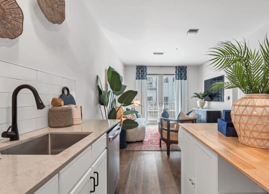 a kitchen with a sink and a view of a living room at Casa Marti, Tampa