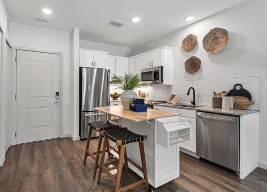 a kitchen with a large island and stainless steel appliances at Casa Marti, Tampa, FL, 33605
