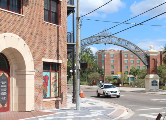 a city street with a car driving under a bridge at Casa Marti, FL, 33605