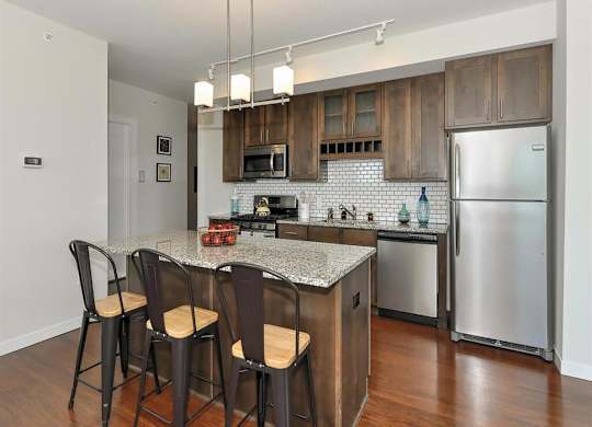 Fitted Kitchen With Island Dining at Bluestone Flats, Minnesota