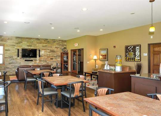 a restaurant with tables and chairs and a fireplace at Boulder Ridge, Duluth, MN 55811