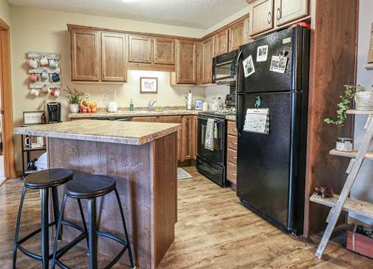 a kitchen with a counter top and a refrigerator at Boulder Ridge, Duluth, 55811