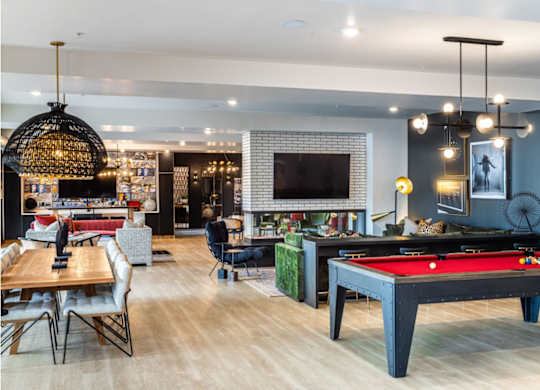 pool in a room with a pool table.at Converge KC Uptown, Kansas City, 64111