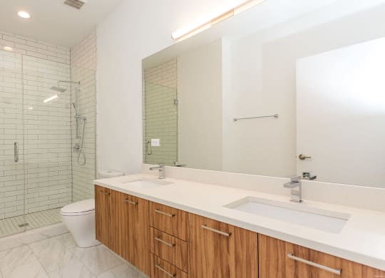 a bathroom with a sink toilet and a shower
