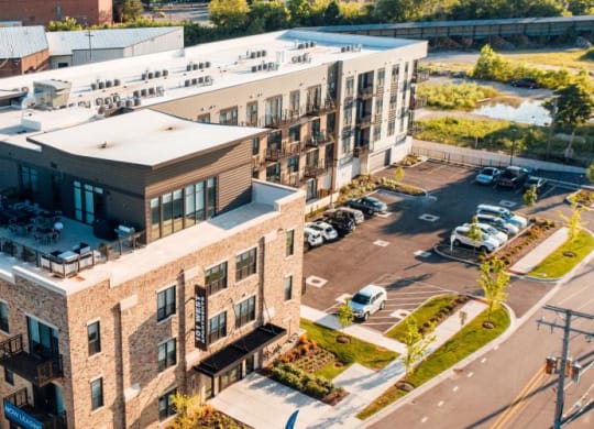an aerial view of an apartment building with a parking lot at Barrington 101, Barrington, 60010