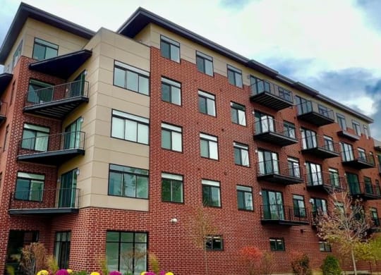 a red brick apartment building with balconies at Highwood 546, Highwood, IL 60040