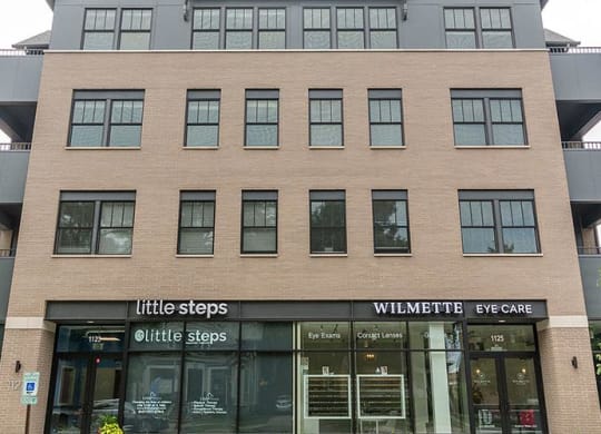 a large building with a store in front of it at Wilmette 1121, Illinois, 60091