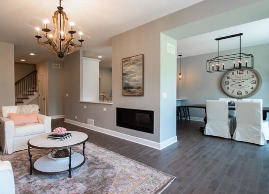 a living room with a fireplace and a table at Countryside Townhomes, Countryside, 60525