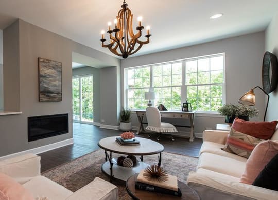 a living room with a couch and a table at Countryside Townhomes, Countryside, IL 60525