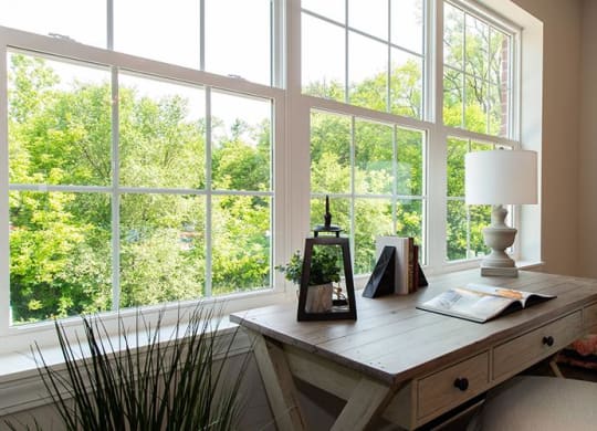 a room with a desk and a large window at Countryside Townhomes, Countryside, IL 60525
