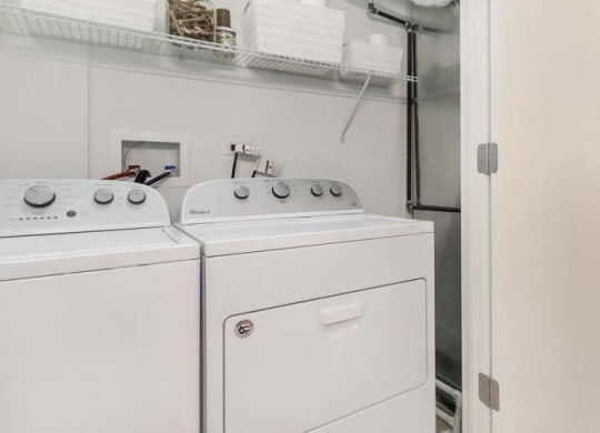 a white washer and dryer in a room next to a closet at Clarendon Hills 229, Clarendon, 60514