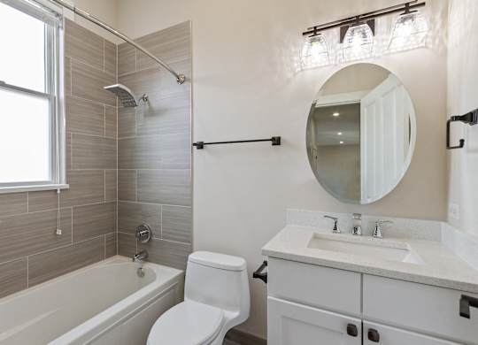 a bathroom with a sink toilet and a bath tub