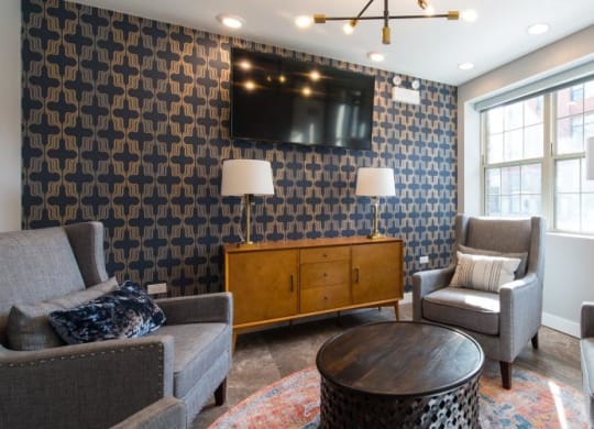 a living room with couches and chairs and a tv  at Kedzie 4447, Chicago, Illinois