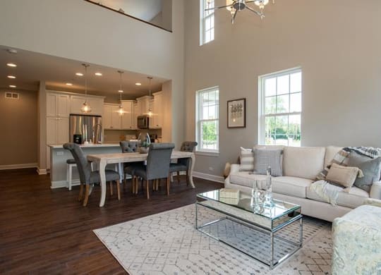 a living room with a couch and a table at Countryside Townhomes, Countryside, IL