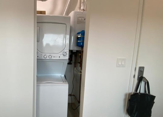 a white washer and dryer in a white closet at Highwood 546, Highwood Illinois