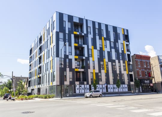a new apartment building on the corner of a city street at Talman 1554, Chicago, 60622